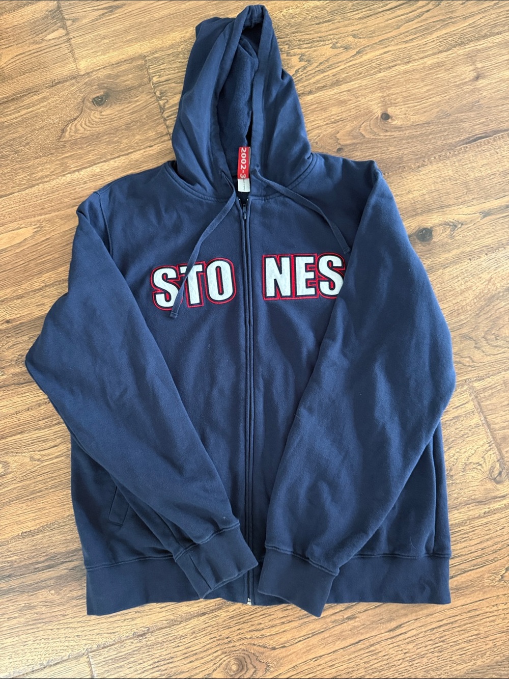 the Rolling Stones Navy Zip-Up Hoodie with Red & White Lettering